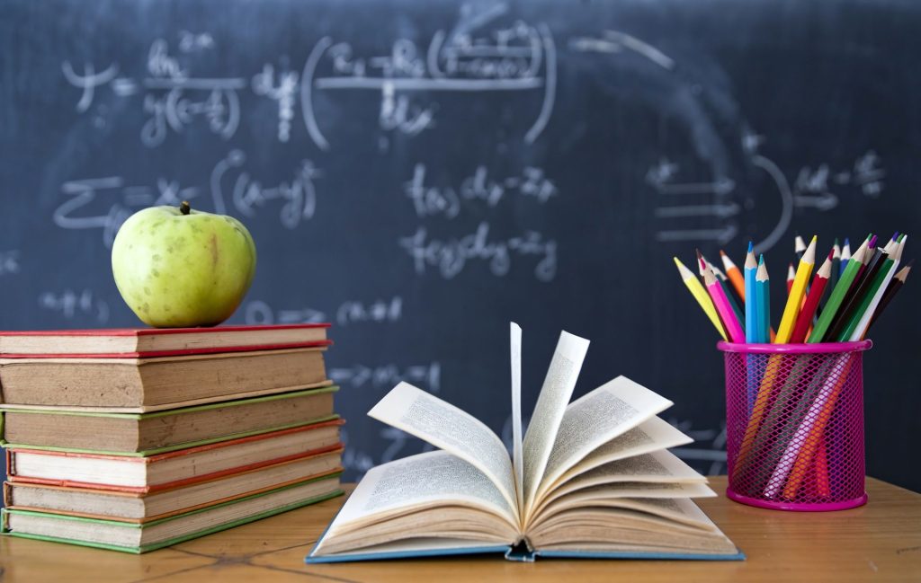 pencils-and-book-and-blackboard